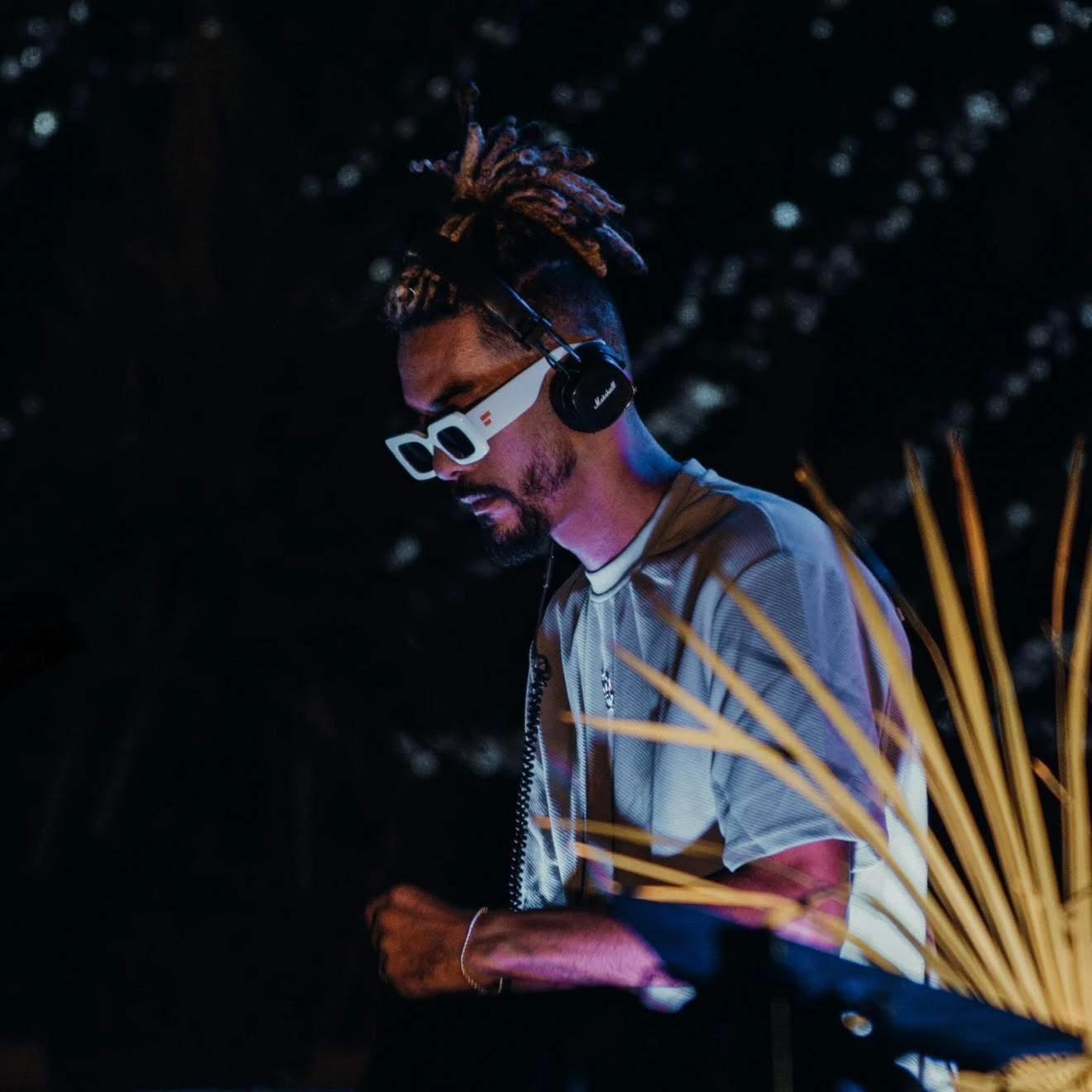 DJ JOK3R performing with headphones